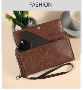 Brown litchi grain leather wallet with front phone slot and secure snap closures