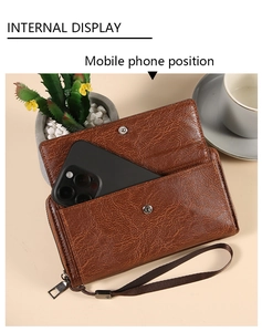 Brown retro leather wallet detail showing the snap-button front pocket for mobile phones