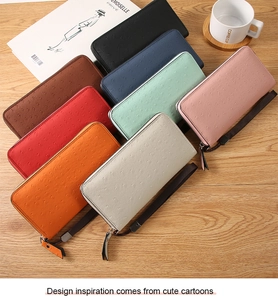 Detailed top view of various colorful ostrich-textured PU leather wallets with wrist straps