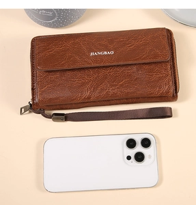 Brown oil wax leather men's wallet with hand strap and phone for size comparison