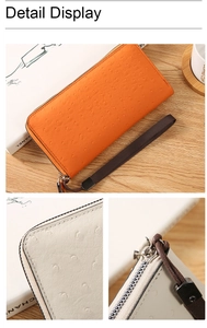 Macro shot of high-quality ostrich pattern faux leather and metal zipper on long wallet