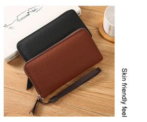 Detail of ostrich pattern PU leather long wallet with wristlet and metal zipper finish
