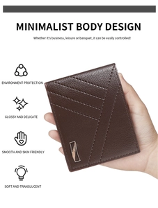 Close-up of brown lychee grain leather wallet with V-shaped stitching and metal trim