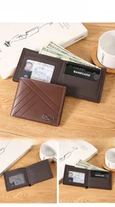 Close-up of brown leather bifold wallet featuring V-shaped stitching and interior card slots