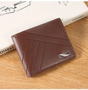 Close-up of men's short wallet in brown litchi grain leather with decorative stitching