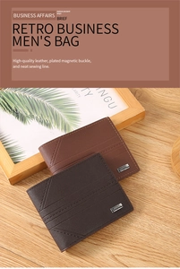 Close-up of premium leather wallets with fine stitching and magnetic buckle on wood surface
