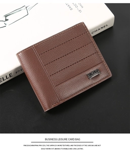 Detail of dark brown pebble leather business wallet with parallel stitching and metal logo