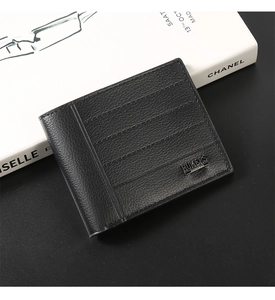 Macro view of black lychee grain leather wallet with horizontal stitching and logo