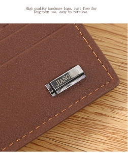Close-up of rust-free metal logo and stitching on brown textured leather men wallet
