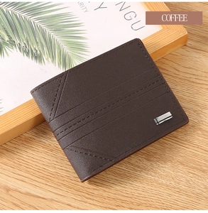 Macro detail of brown leather wallet featuring diagonal stitching and metal nameplate