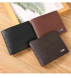Detailed view of three faux leather bifold wallets in black and brown with metal logo