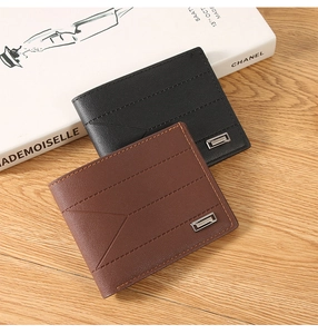 Close-up of black and dark brown wallets with detailed stitching and metal logo