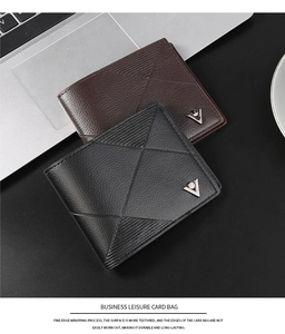 Close-up of black and brown men's wallets with geometric embossed lines and metal logo