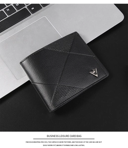 Detail of lychee pattern leather wallet with V-shaped metal logo and stitching finish
