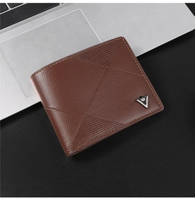 Macro detail of brown leather wallet featuring lychee texture and geometric embossing