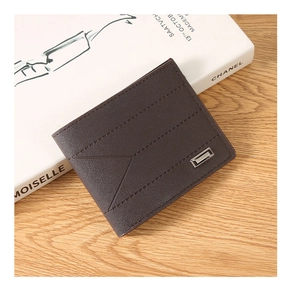Detail of deep brown embossed leather wallet featuring geometric stitching and metal logo
