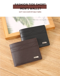 Close-up of men's bifold wallets with wave stitching and metallic logo on textured fabric