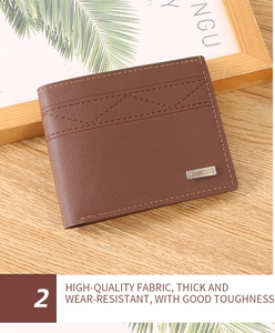 Detail view of deep brown leather wallet with embossed stitching and metal logo