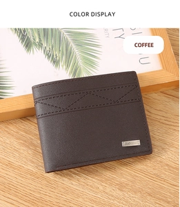 Close-up of a coffee brown textured leather wallet with stylish wave stitching on a wooden desk