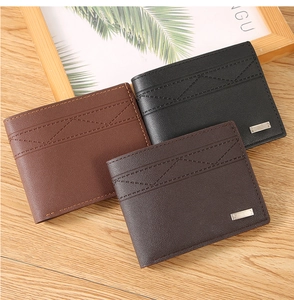 Close-up of men's bifold wallets with V-shaped stitching and metallic logo details