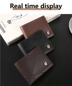 Close-up of slim bifold leather wallets in black and brown with diamond stitch detail