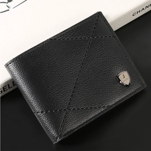 Close-up of black bifold wallet featuring lychee grain leather and geometric stitching
