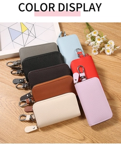 Custodie per chiavi in pelle PU litchi in otto colori con ganci in metallo su legno