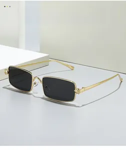 Detailed view of square metal sunglasses featuring a golden leopard head hinge design