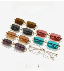 Detailed macro view showing seven rectangular metallic frames with ornate skull hinge designs
