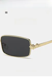 Detailed close-up of golden metal hinge with panther emblem on square sunglasses