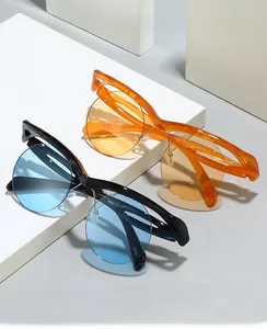 Detail of 2024 semi-rimless oversized frame sunglasses with vibrant blue and orange lenses