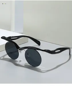 Detail of round sunglasses featuring wave-sculpted frames and UV400 protection marking