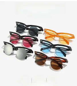 Flat lay of irregular half-frame sunglasses in six diverse colors with round lenses