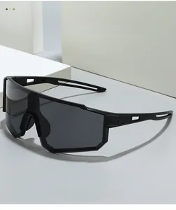 Detail of matte black Y2K cycling sunglasses featuring futuristic aerodynamic temple vents
