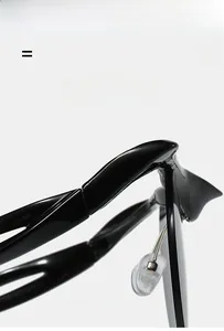 Detail shot of black semi-rimless frames showing flexible hinges and soft silicone nose pads