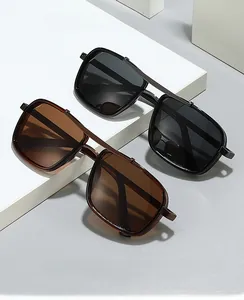 Detail of square double-bridge computer safety glasses in black and brown frames