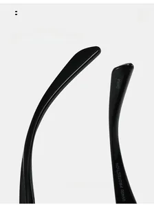 Detail of curved black sunglasses legs with UV400 protection and ergonomic design