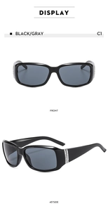Vue détaillée de lunettes de soleil ovales avec strass sur monture noire et verres gris
