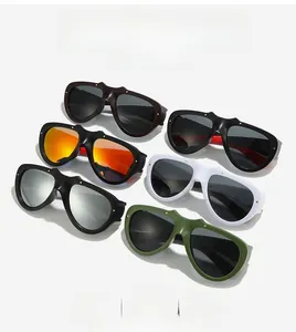 Flat lay of cat-eye sunglasses in black, brown, pearl white, and olive green frames