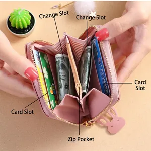 Pale pink women's wallet featuring cute rabbit zipper puller and striped inner lining