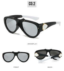 Close-up of black matte frames with white temples and golden metal hinge detail