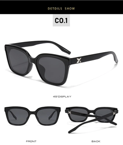 Detail showing oversized black TR polarized sunglasses with silver X-shaped temple accents