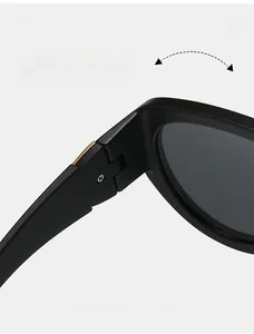 Detailed close-up of high-durability metal hinges on stylish black cat-eye sunglasses