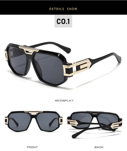 Detail view of oversized retro aviator sunglasses with black frame and gold metal accents