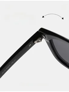 Detail view of durable metal hinges and size specifications on black TR polarized sunglasses