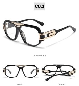 Close-up of black pilot glasses frame with gold metal bridge and hollow temple design