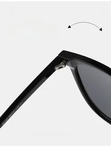 Macro detail of durable metal hinges and model specifications on the black eyewear frames