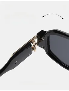 Close-up of a durable metal hinge on retro square sunglasses with black acetate frames