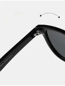 Close-up of reinforced metal hinges and frame details on black polarized sunglasses