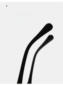 Detail view of glossy black curved mirror legs on retro sunglasses for a comfortable fit